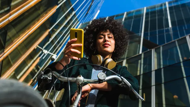 Image of young woman holding a smartphone