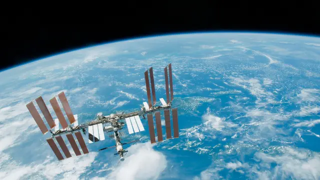 Image of satellite in space with planet earth down below