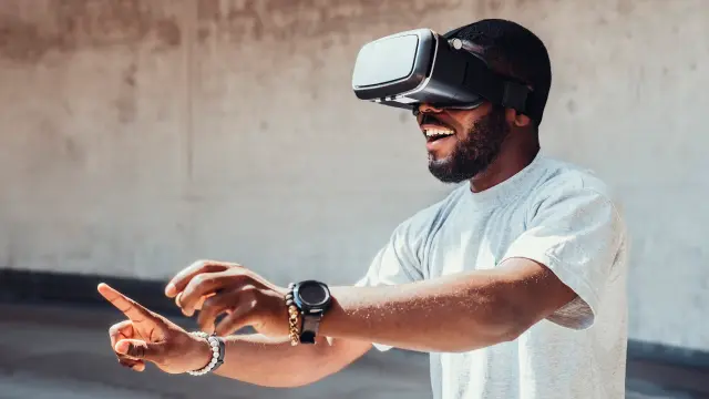 Image of young man wearing virtual reality googles