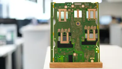 Symbolising efficient and detailed testing and showing the curcial role of high-quality PCB by copperdot in the automotive industry.