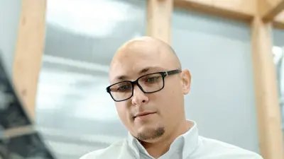 Image of copperdot employee, looking at PCB layouts in development