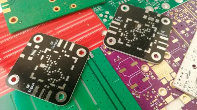 Image of many different PCBs on a pile
